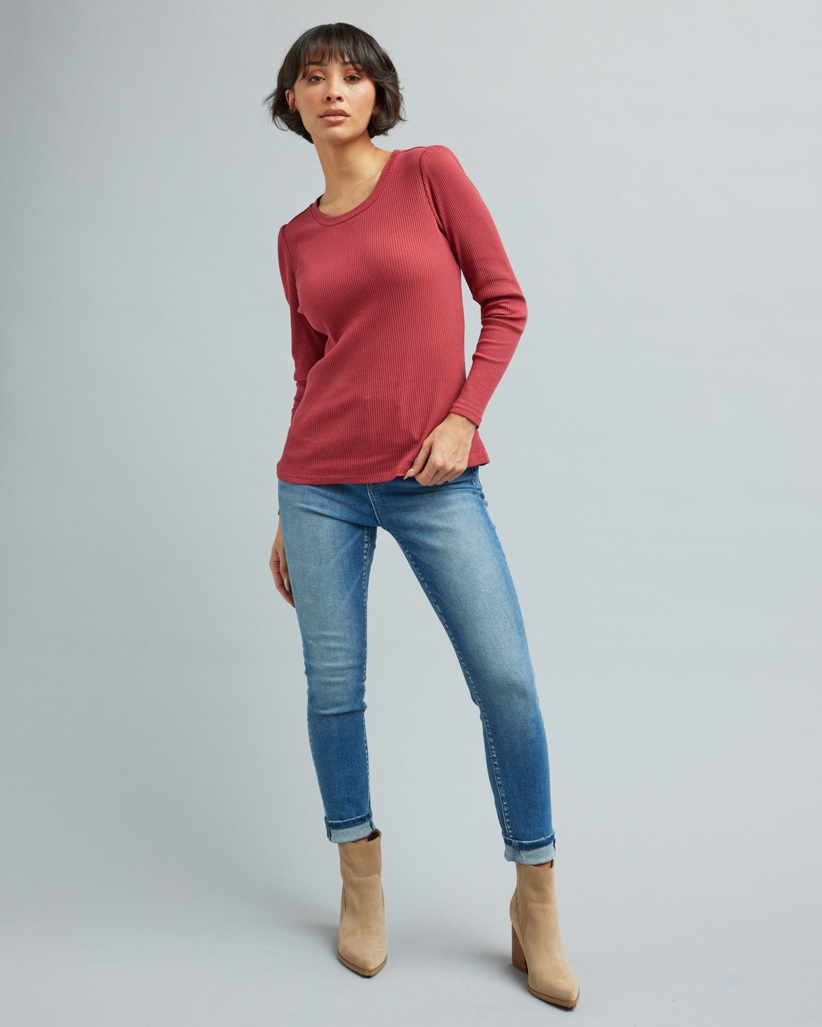 Woman in a long sleeve, ribbed t-shirt