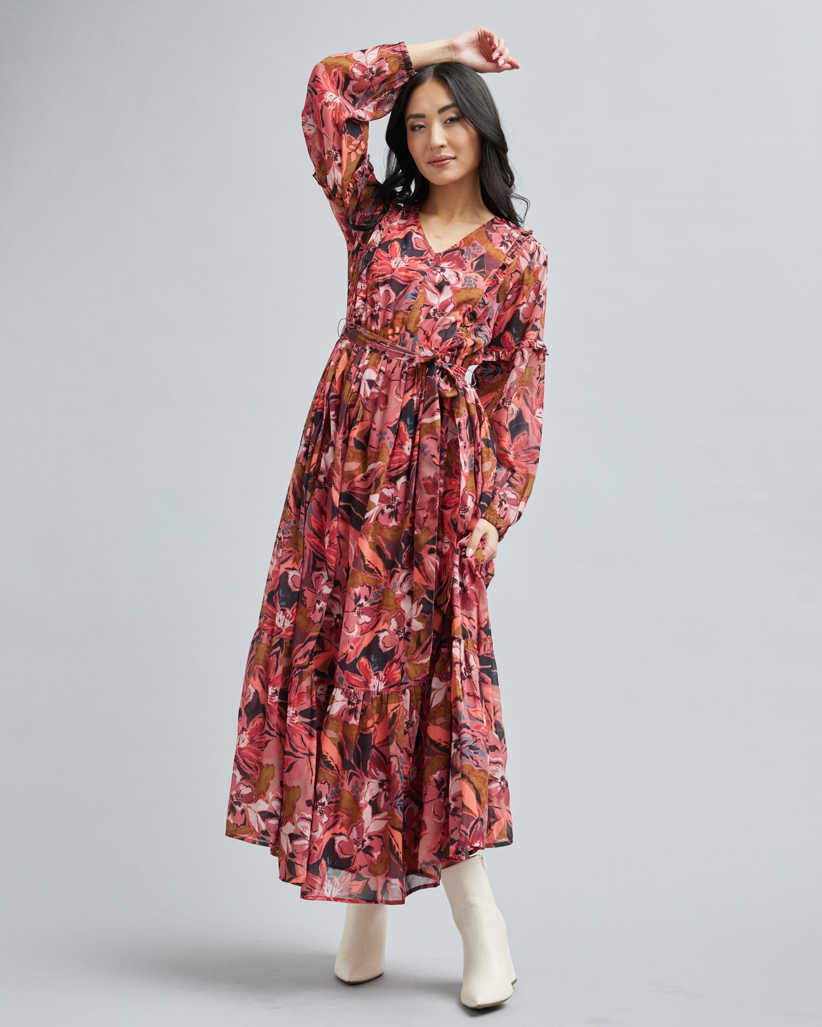 Woman in a long sleeve, floral print, maxi dress
