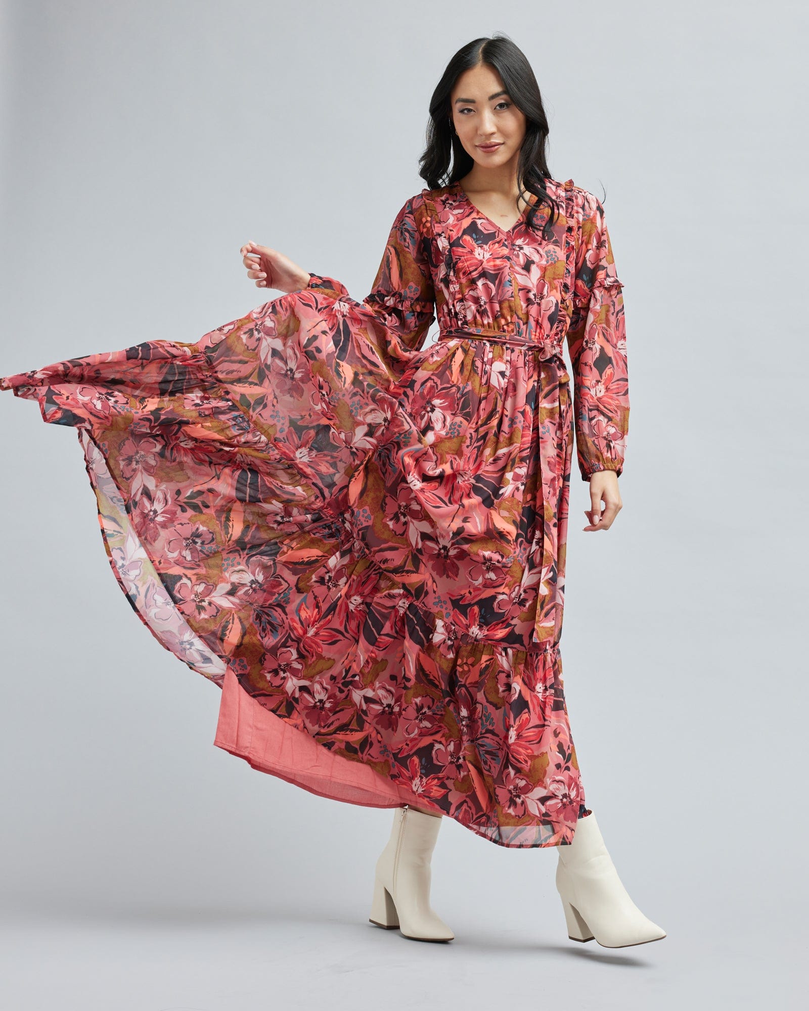 Woman in a long sleeve, floral print, maxi dress