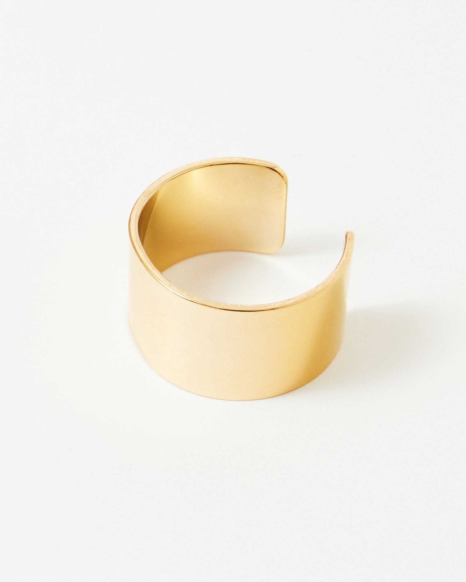 Thick gold ring resembling a cigar band.