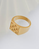 Gold ring with checkered pattern design