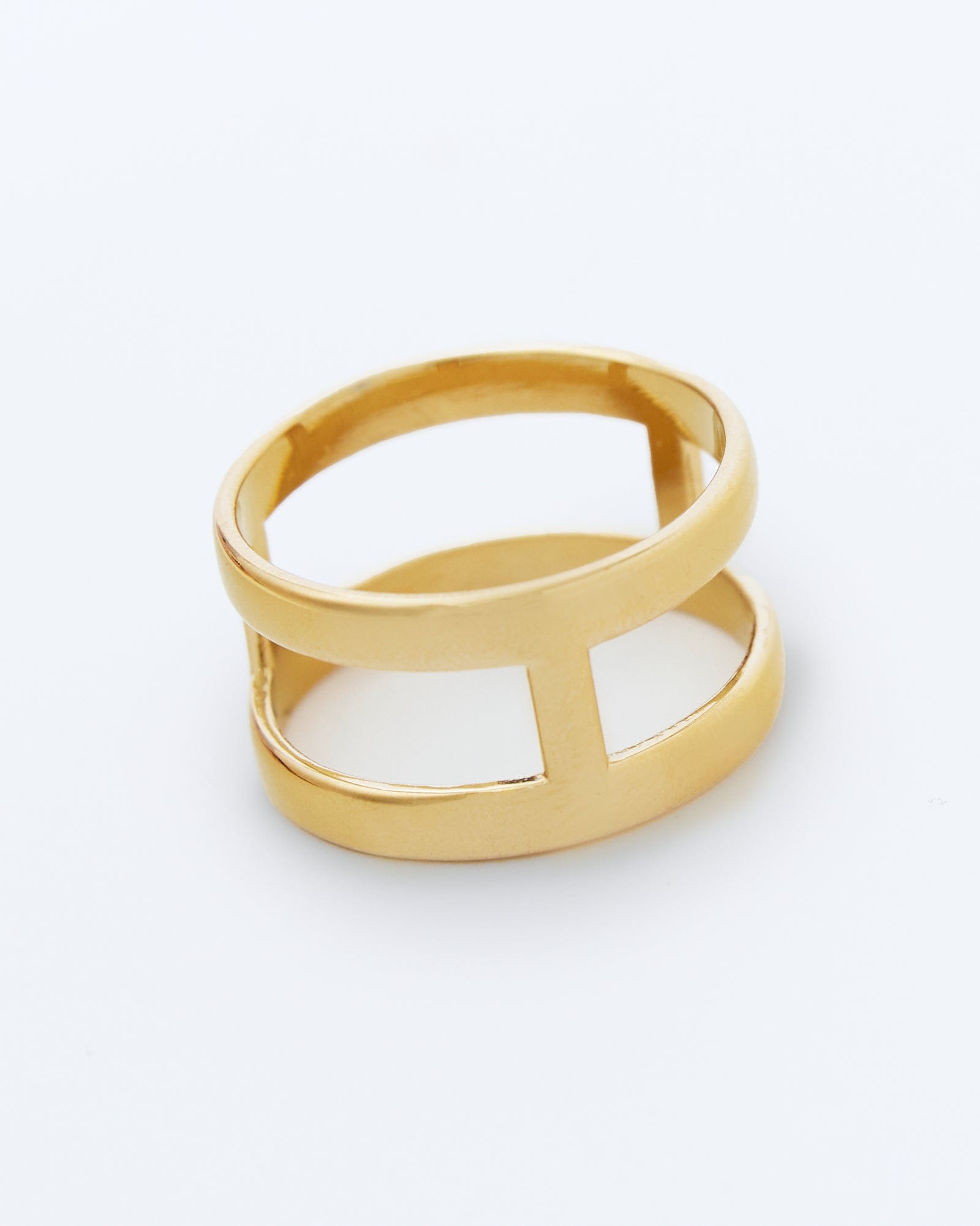 Gold ring with three cut outs.