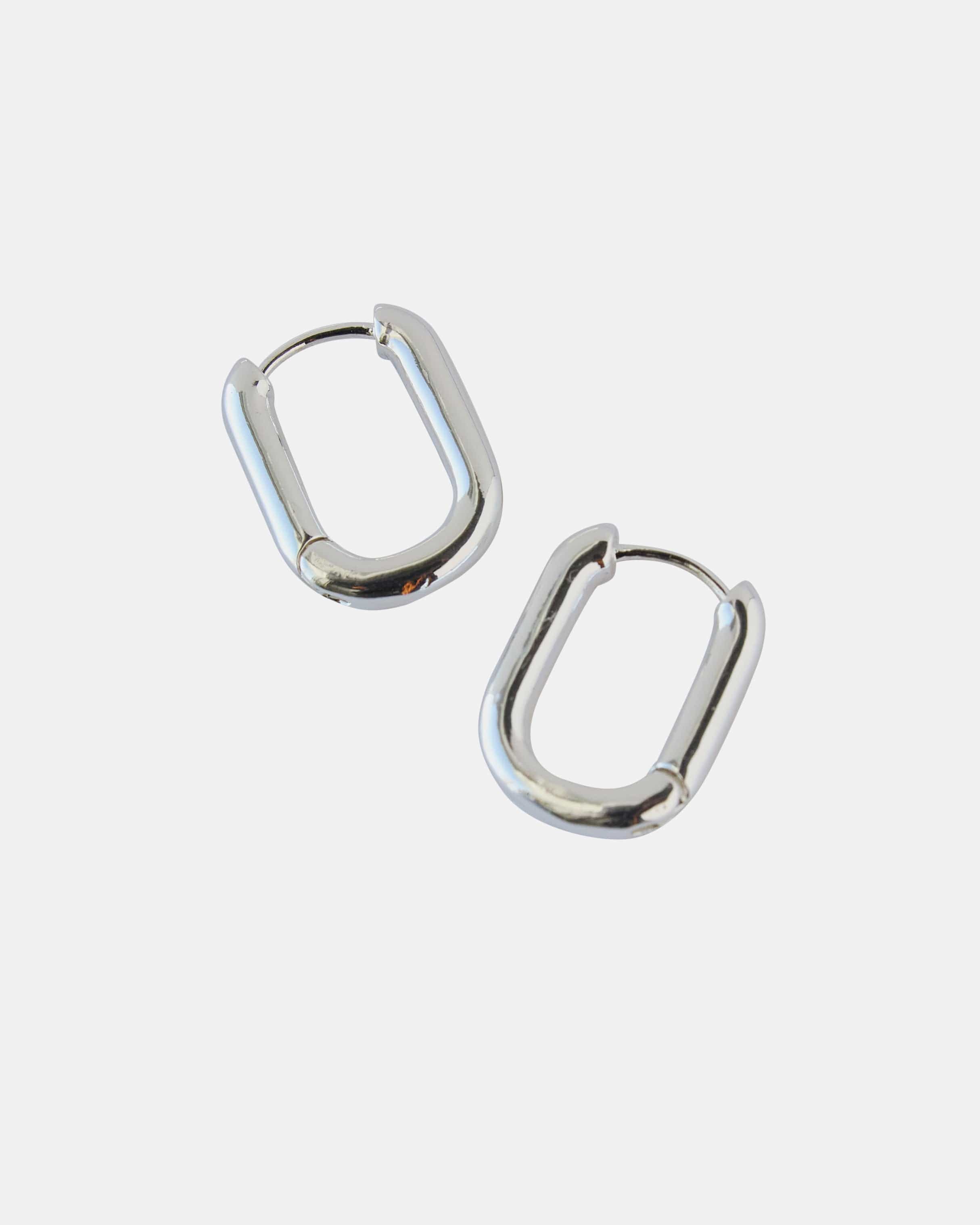 Silver curved hoop earrings.