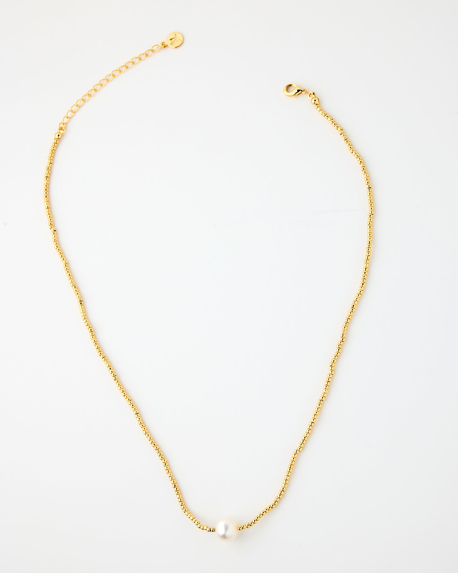 Gold chain necklace with freshwater pearl in middle