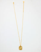 Gold chain necklace with rectangular pendant