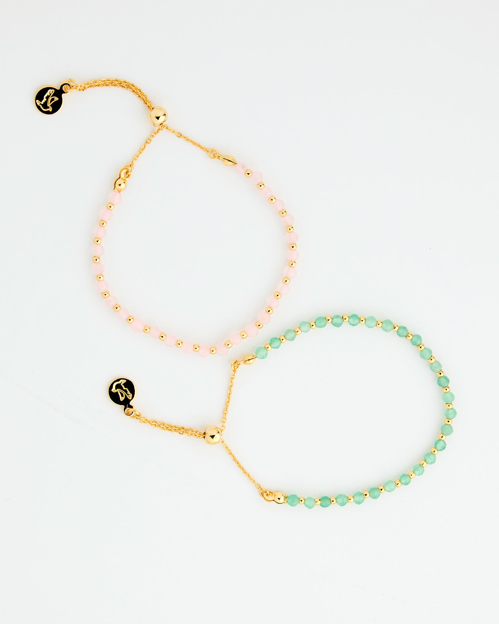 Set of two bracelets with gold chains and pink or green beads