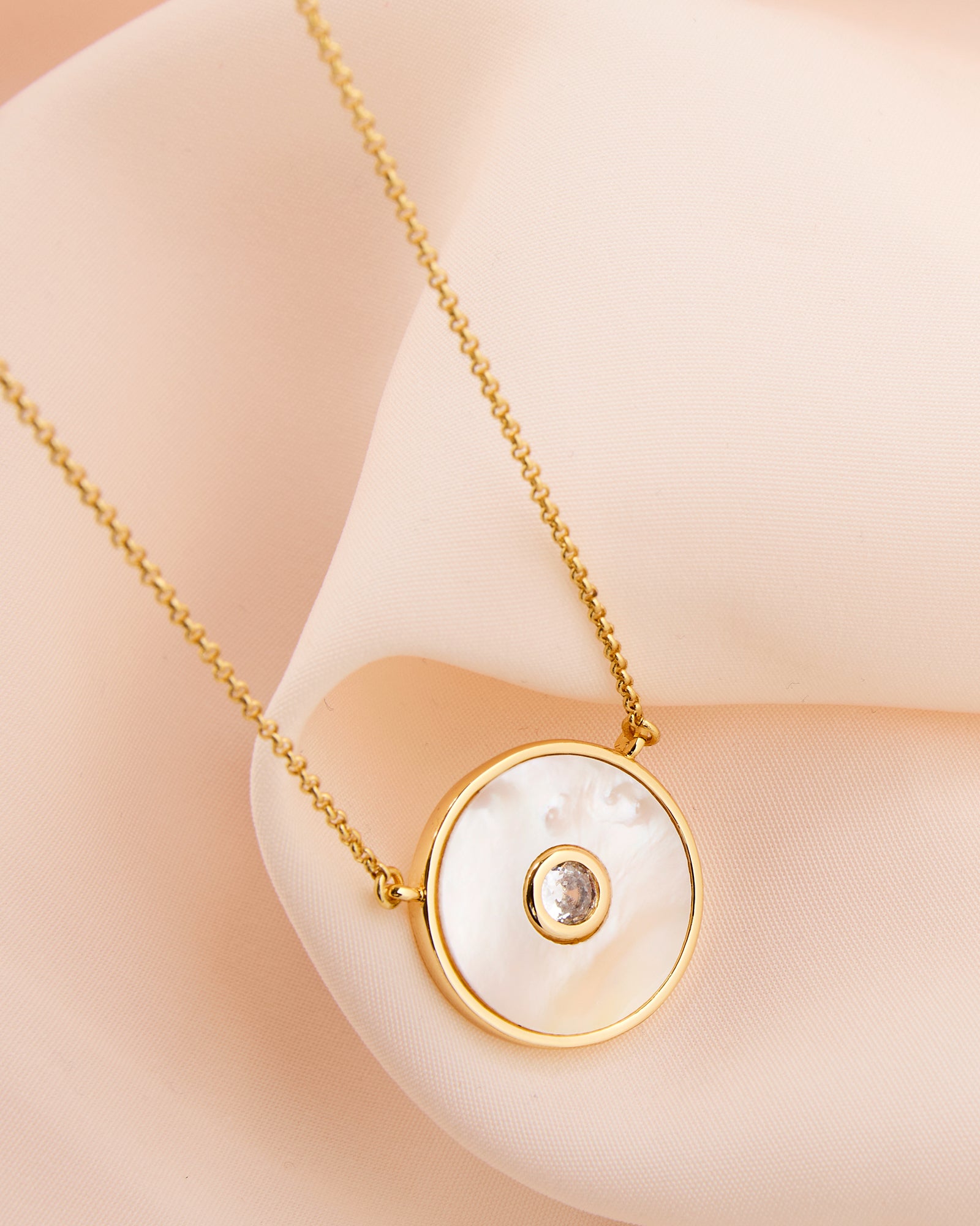 Gold chain necklace with circle pendant