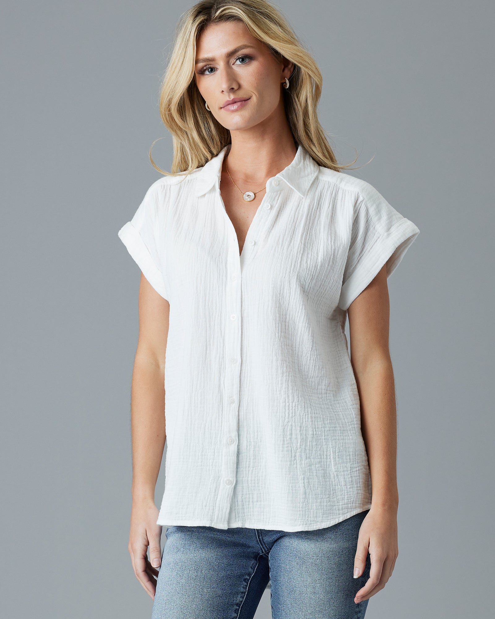 Woman in a white short sleeve buttondown blouse