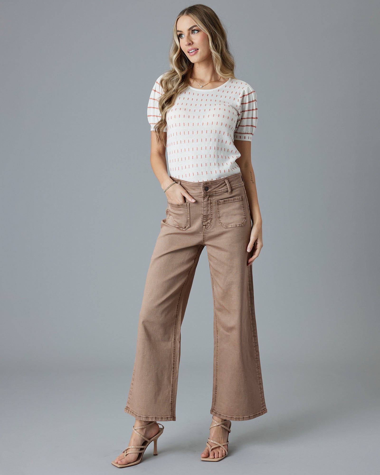 Woman in brown cropped jeans
