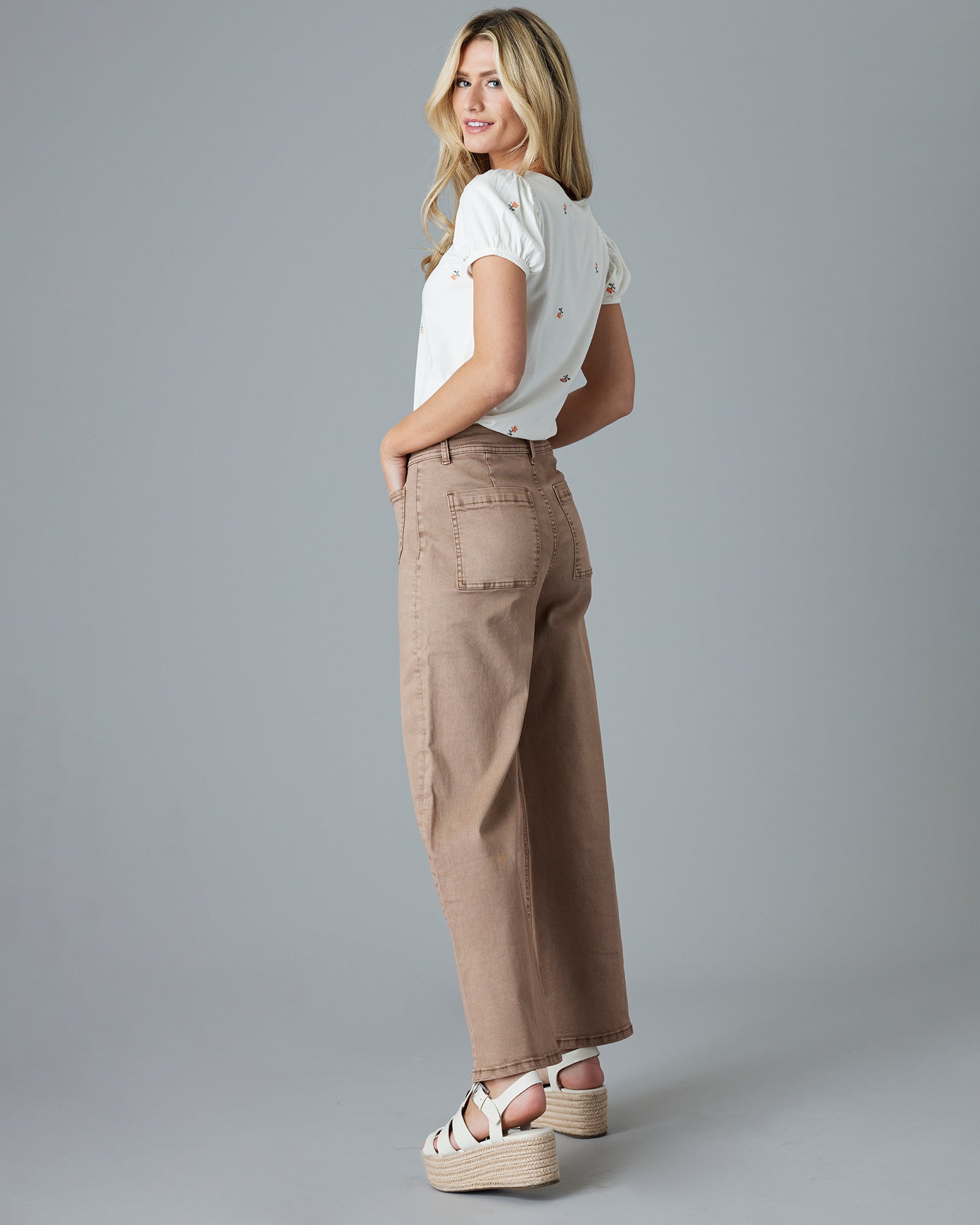 Woman in brown cropped jeans