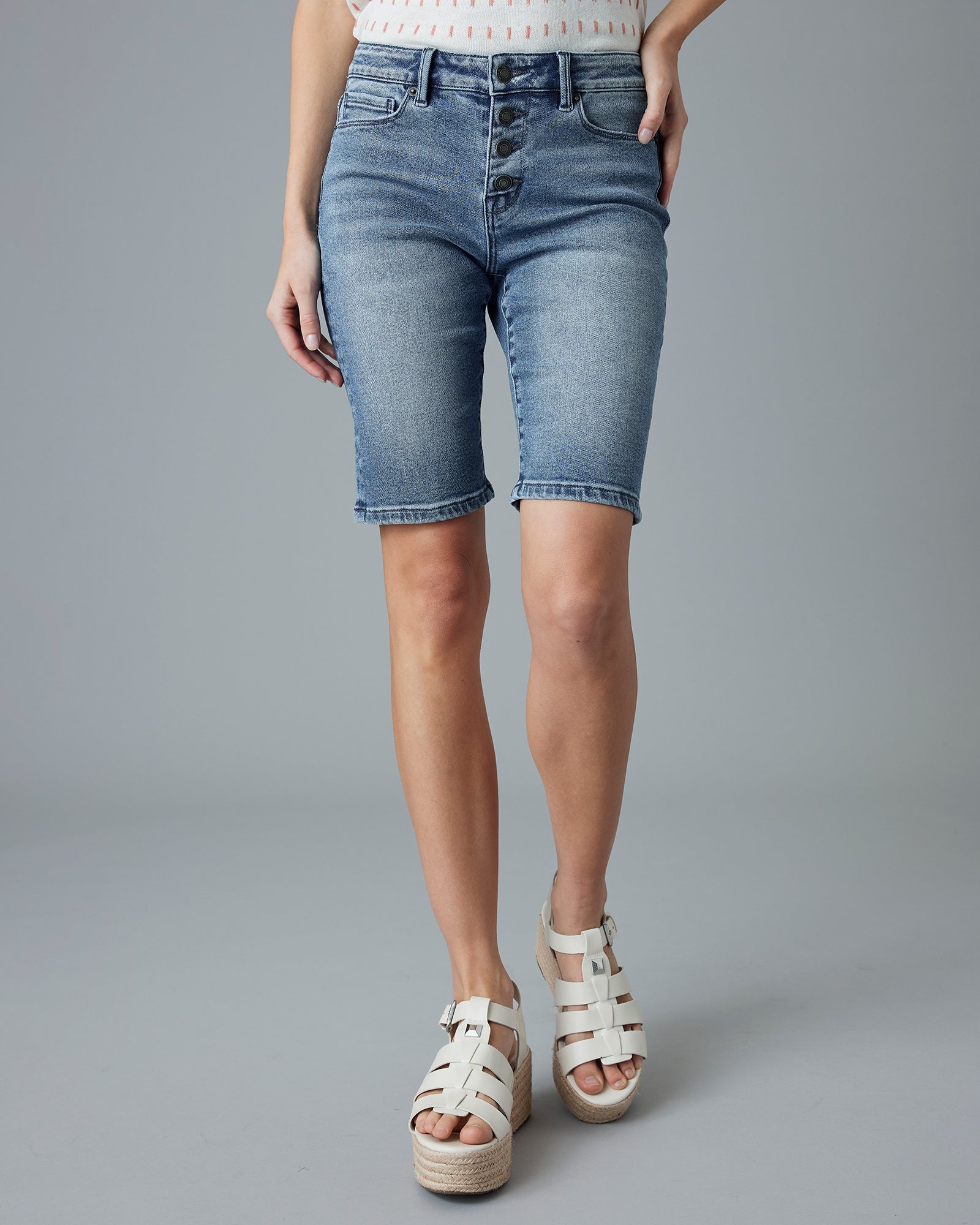 Woman in blue jean, button-fly shorts