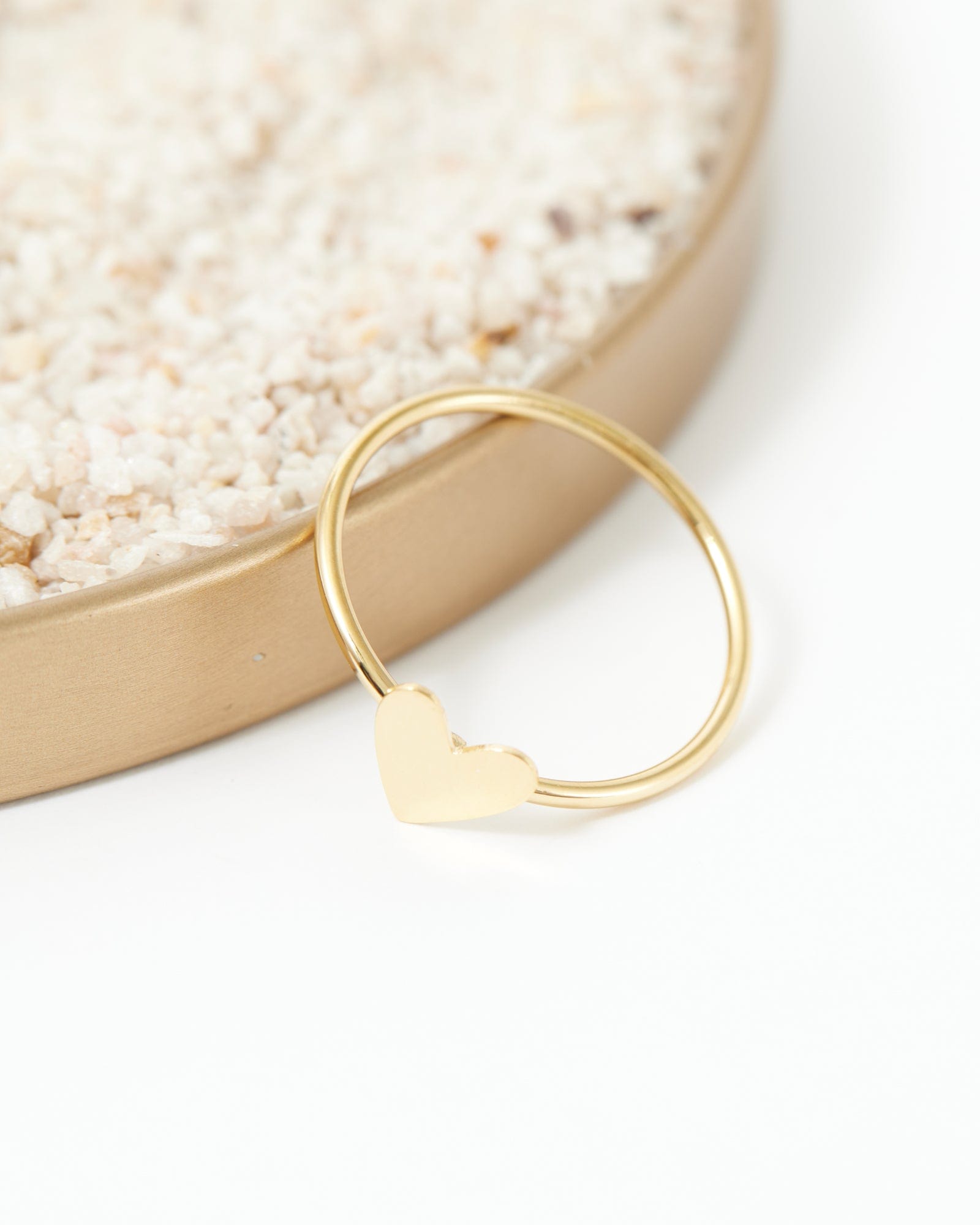Gold dainty ring with heart on it