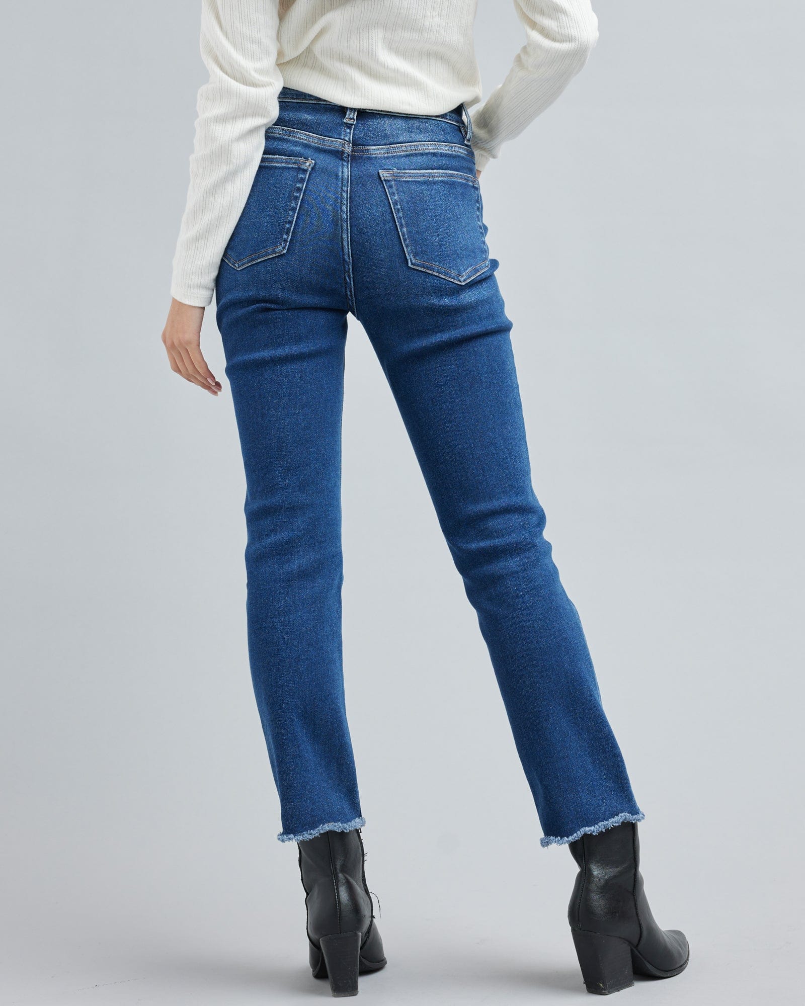 Woman in a blue washed denim pant