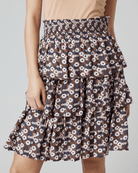 Woman in floral print, knee-length, tiered skirt