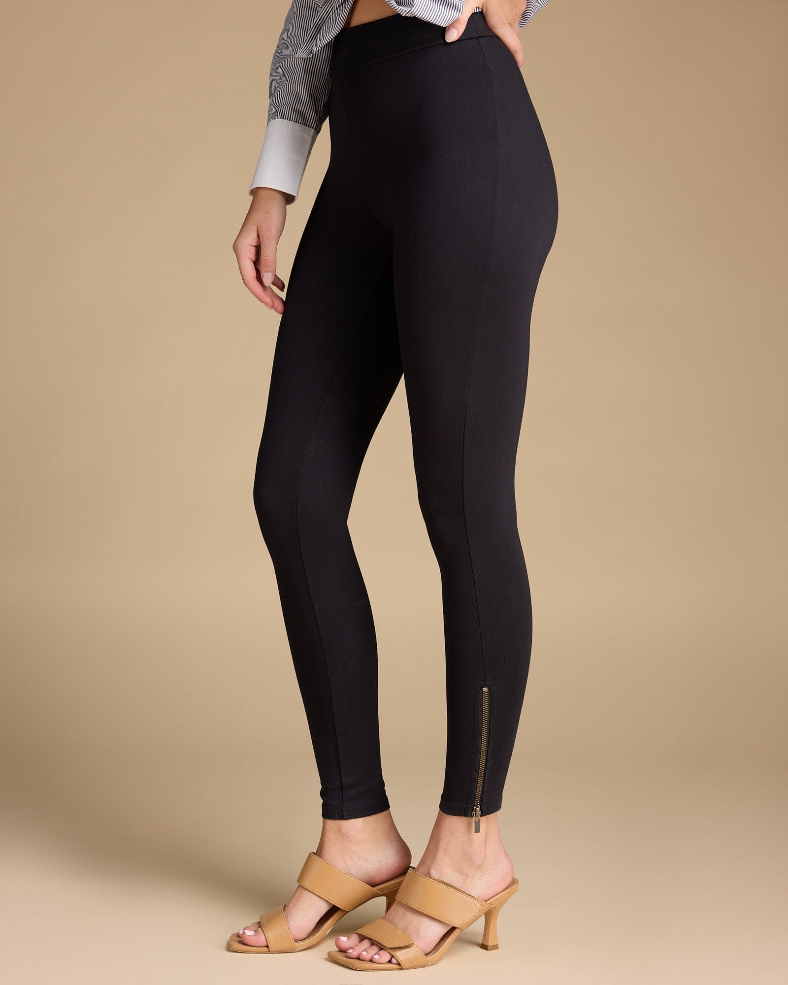 Woman in black solid leggings