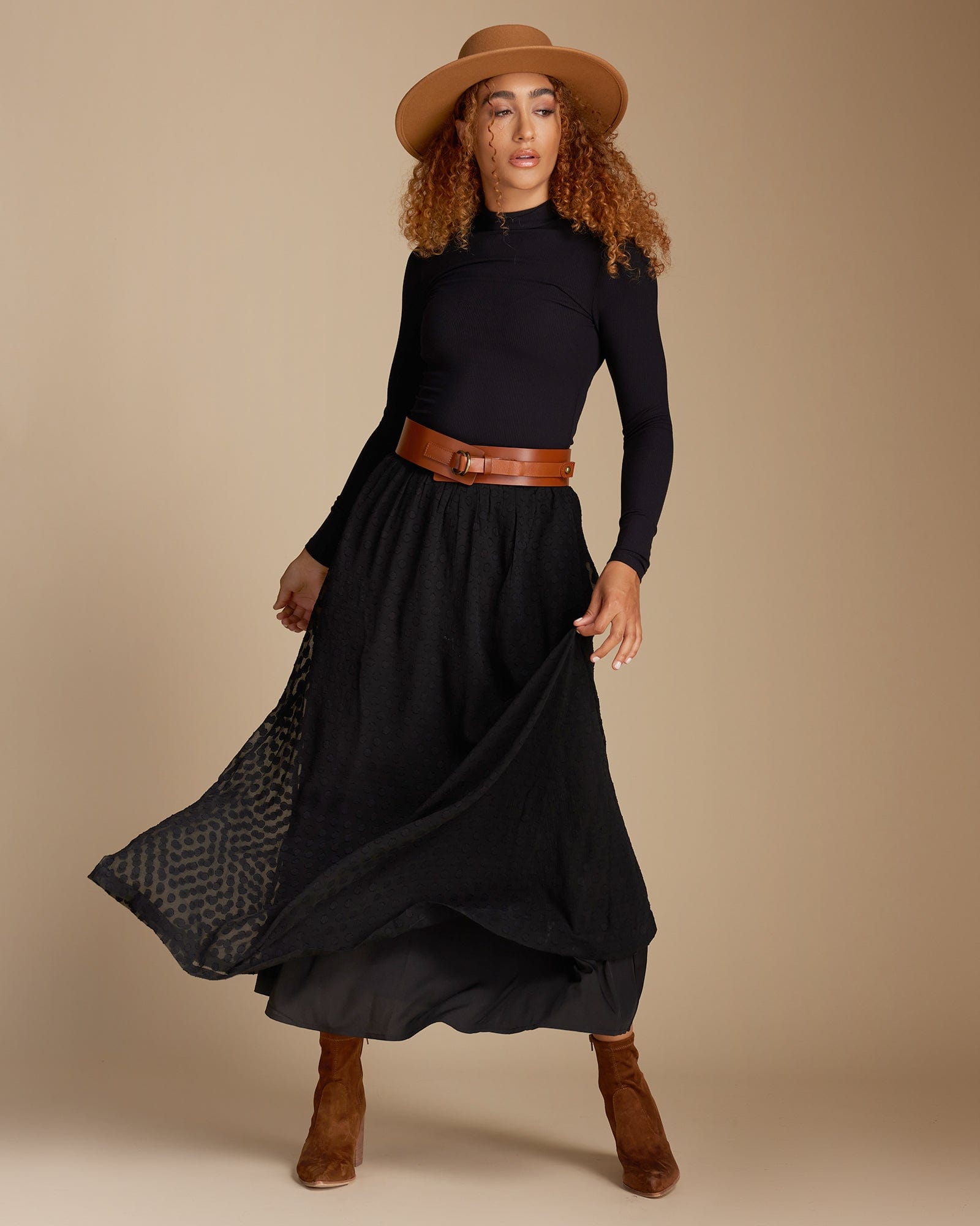 Woman in a black maxi-length skirt