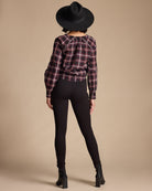 Woman in black, high-waisted leggings