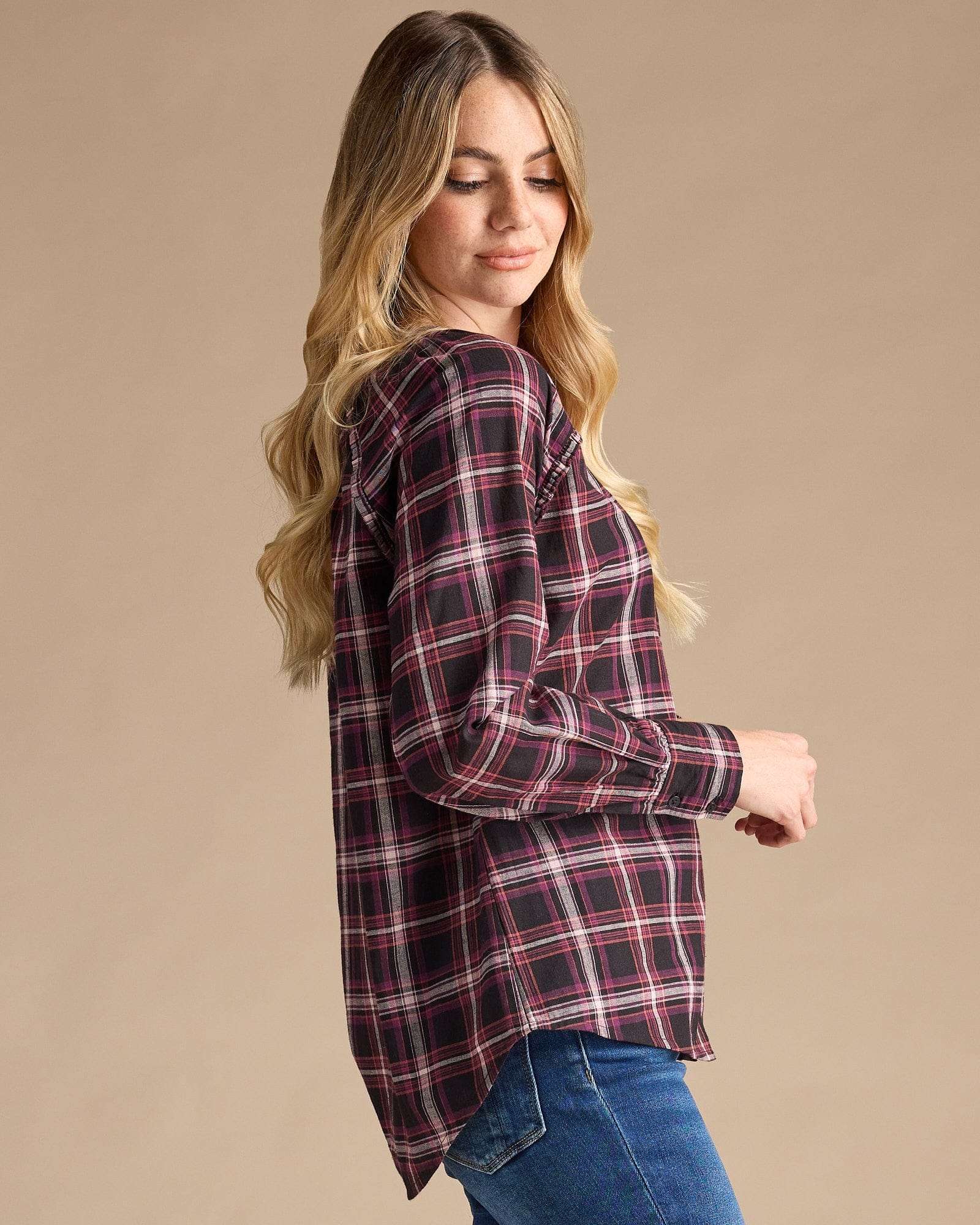 Woman in a blue plaid long sleeve top