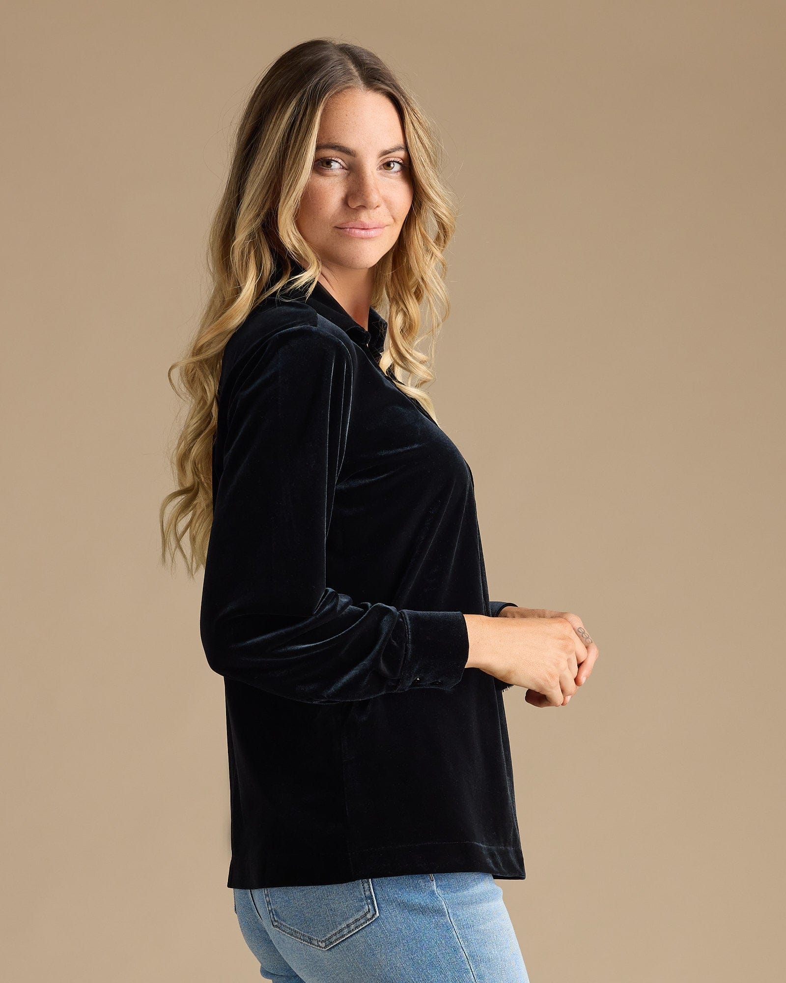 Woman in a black long sleeve blouse