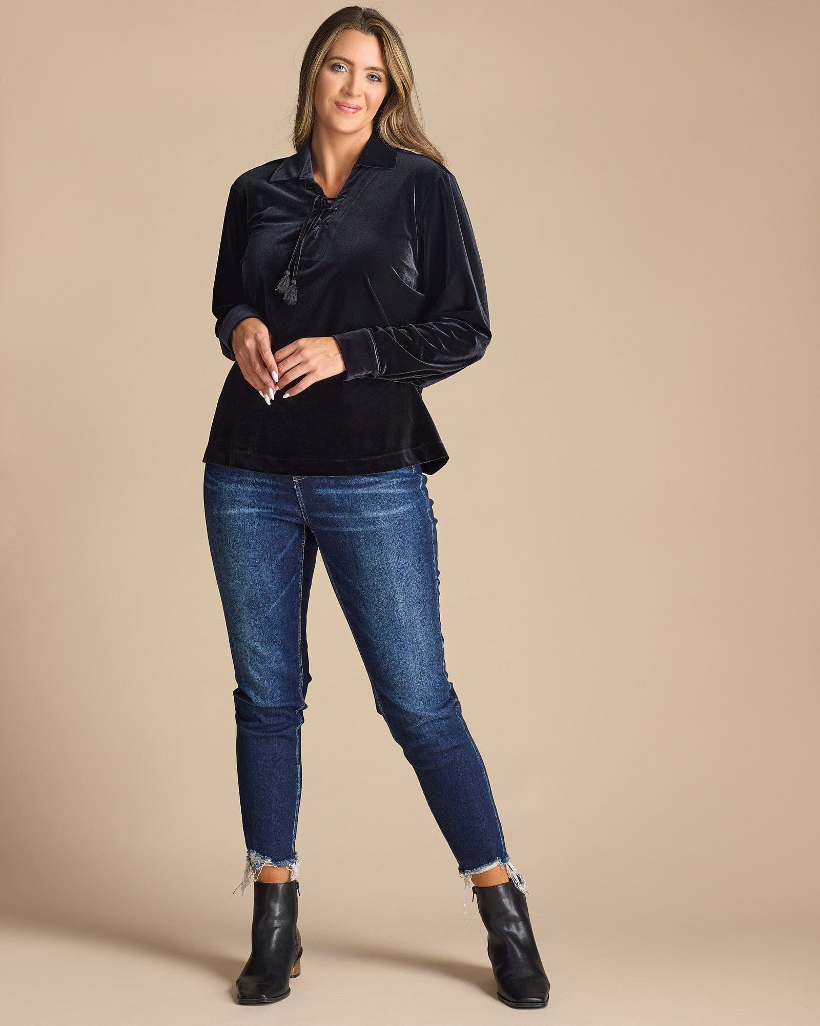 Woman in a black long sleeve blouse