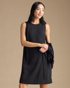 Woman in a black dress with removable sleeves