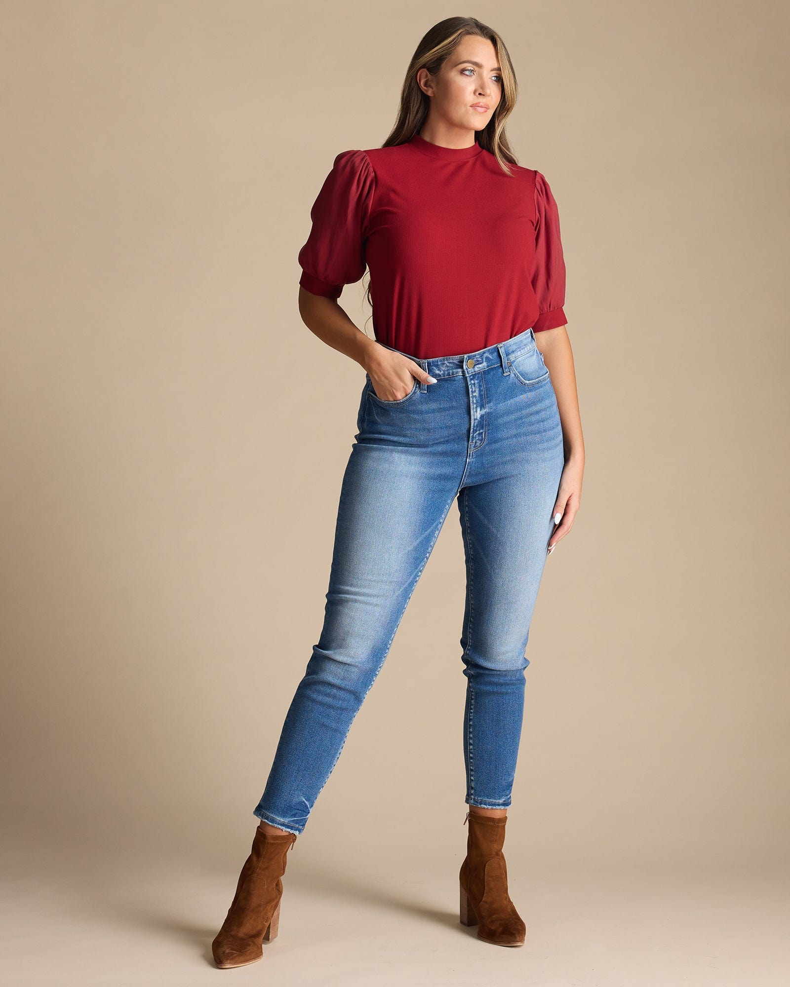 Woman in blue high-rise skinny jeans