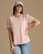 Woman in a light pink short sleeve tshirt