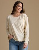 Woman in a tan long sleeve tshirt