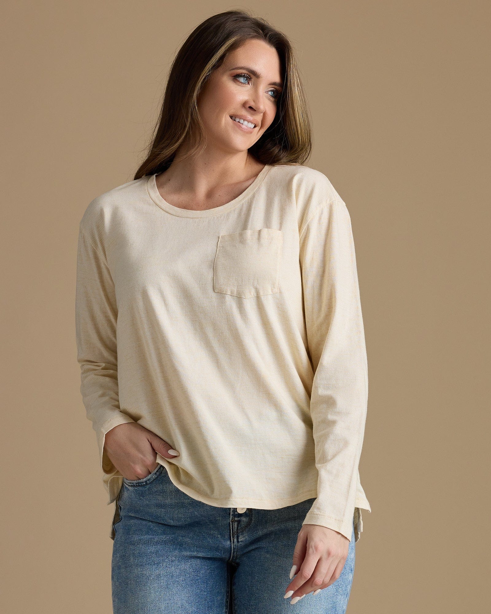 Woman in a tan long sleeve tshirt