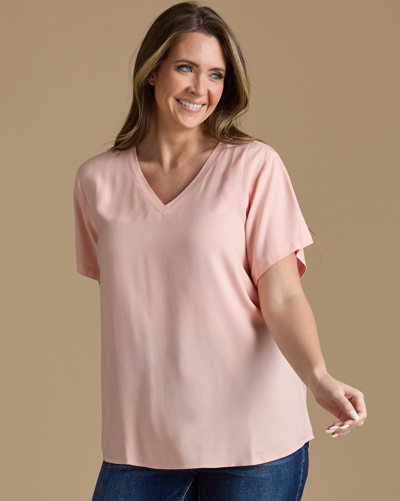 Woman in a pink blouse with short sleeves