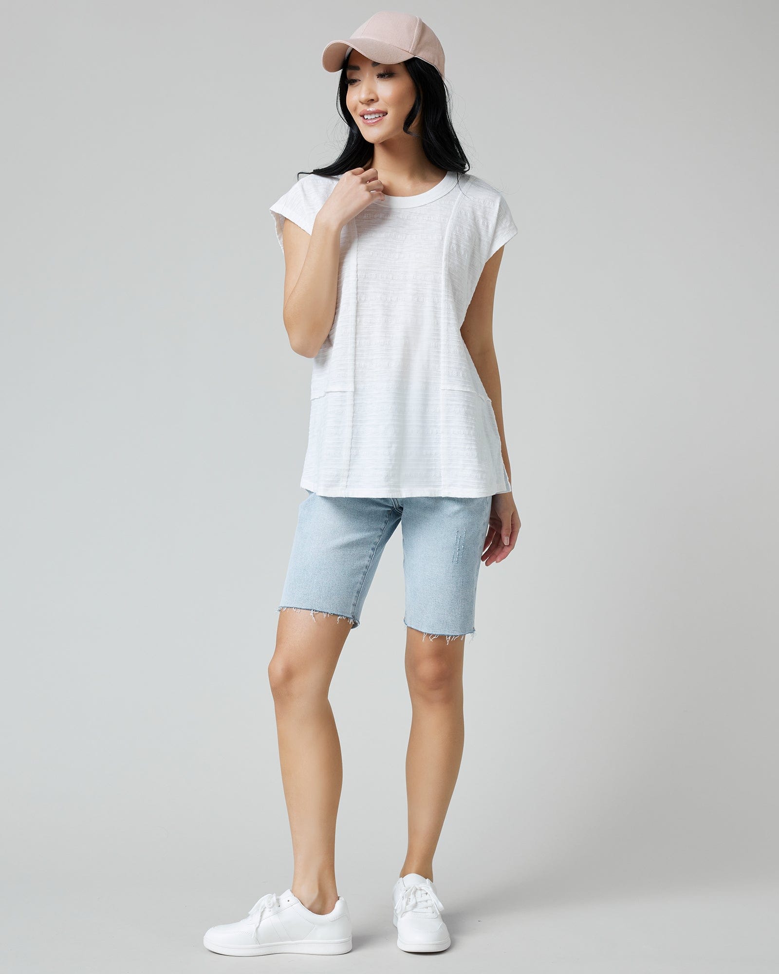 Woman in a white short sleeve t-shirt
