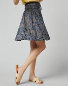 Woman in paisley, knee-length skirt