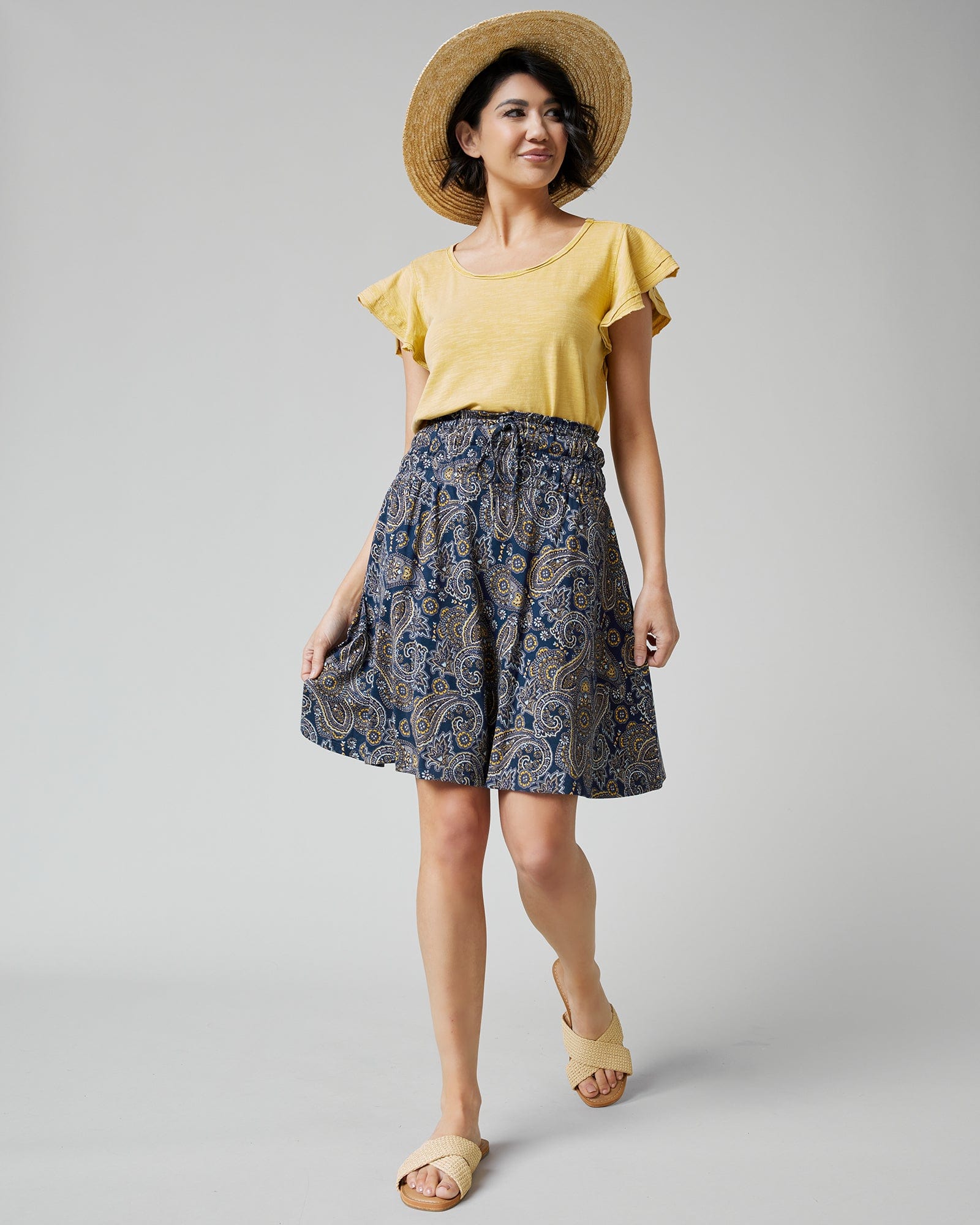 Woman in paisley, knee-length skirt