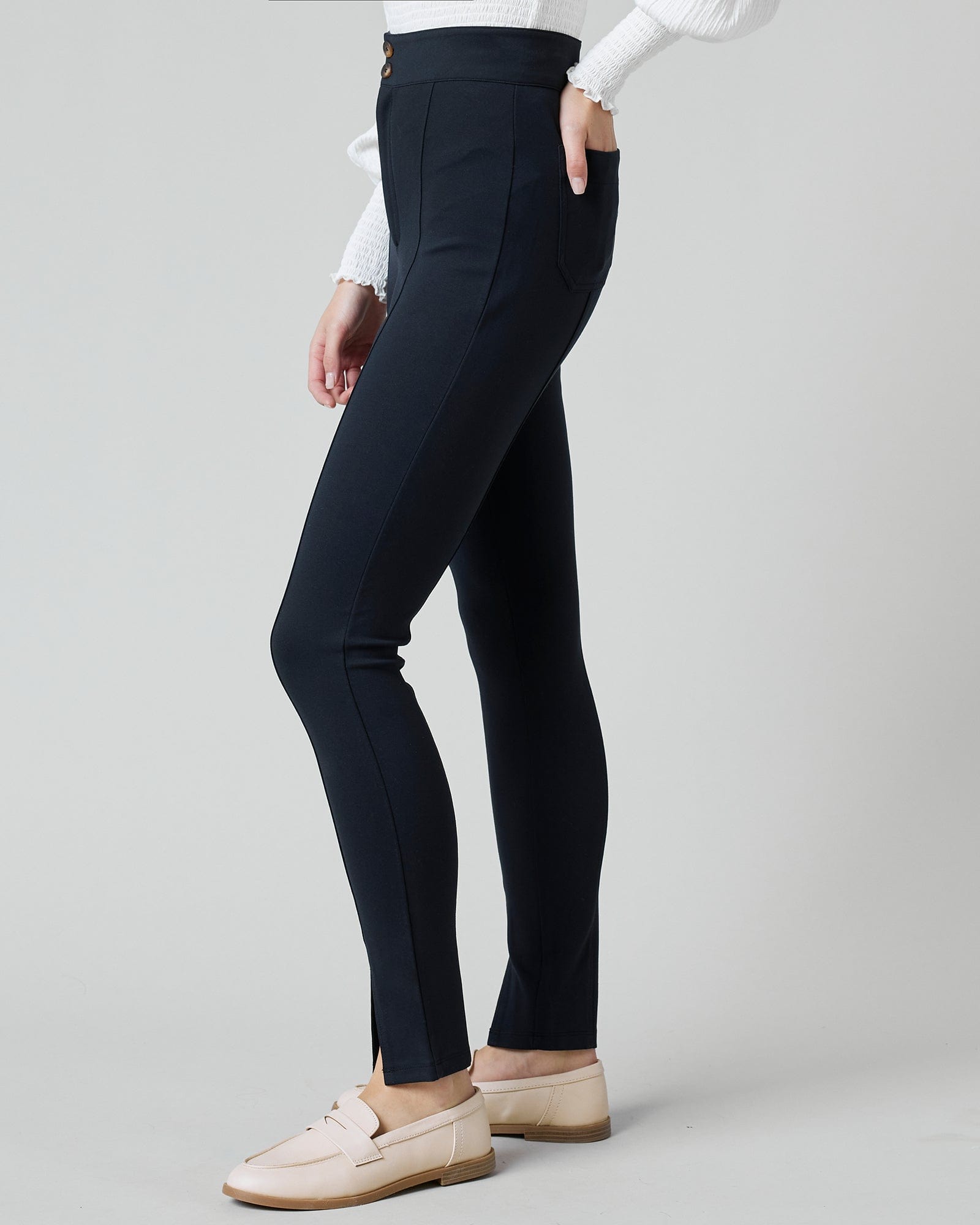 Woman in black fitted pants