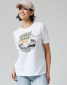 Woman in a white graphic tee with "Venice Beach" on front