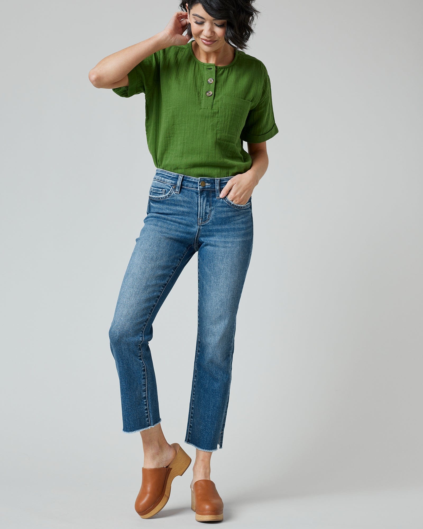 Woman in blue mid-rise cropped denim pants