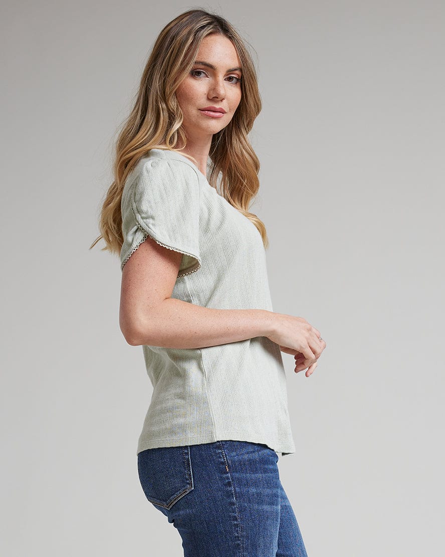 Woman in a short tulip sleeve top