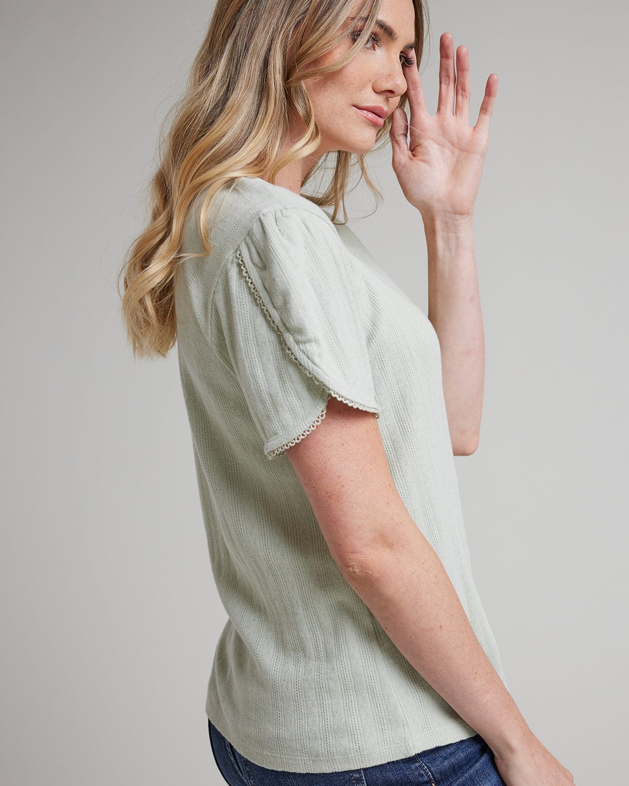Woman in a short tulip sleeve top