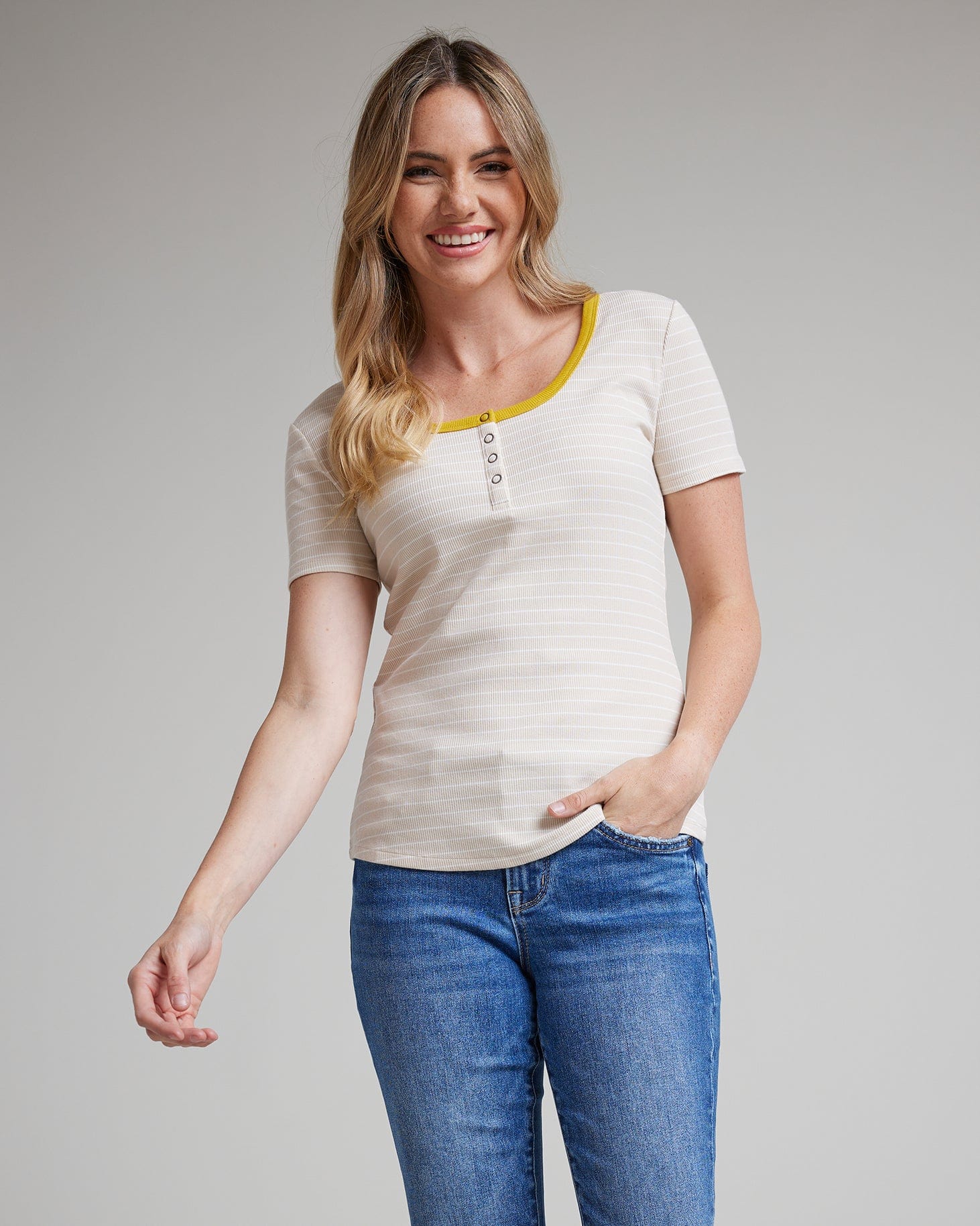 Woman in a white and yellow striped short sleeve t-shirt
