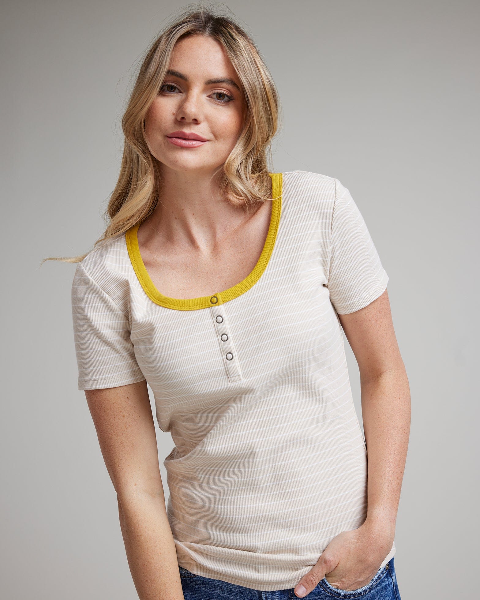 Woman in a white and yellow striped short sleeve t-shirt
