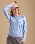 Woman in a light blue long sleeve tshirt