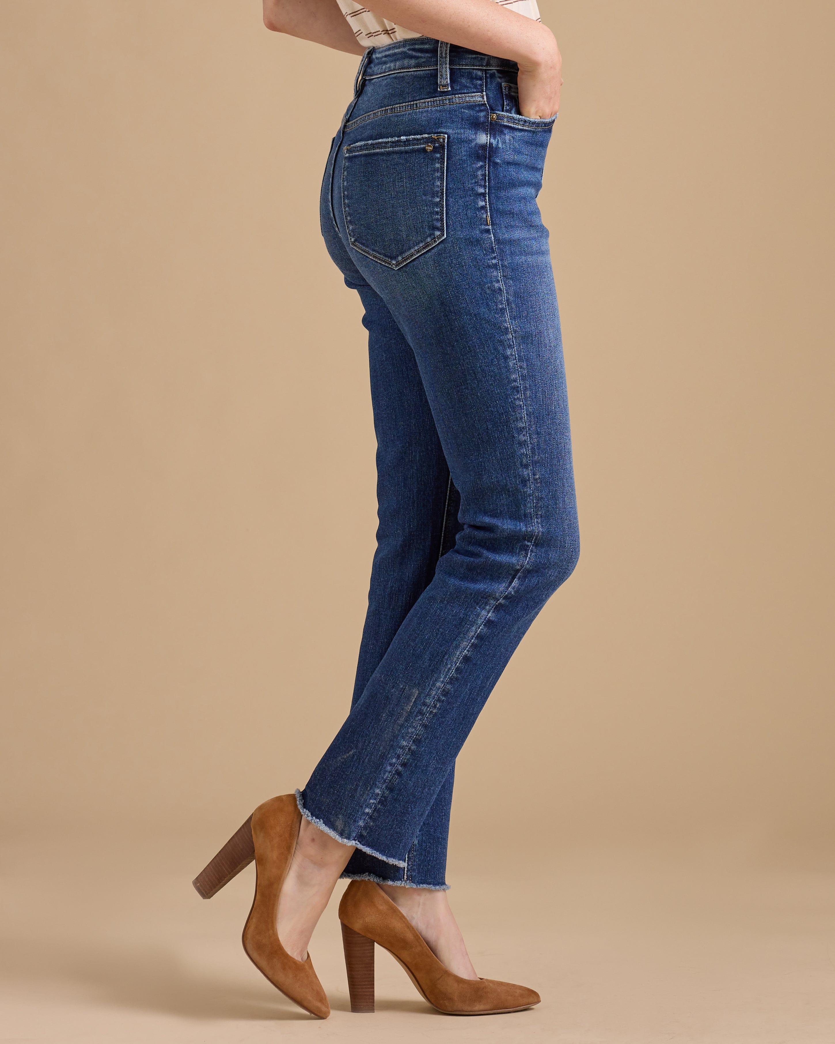 Woman in blue hi-rise straight jeans