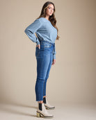 Woman in blue mid-rise skinny jeans