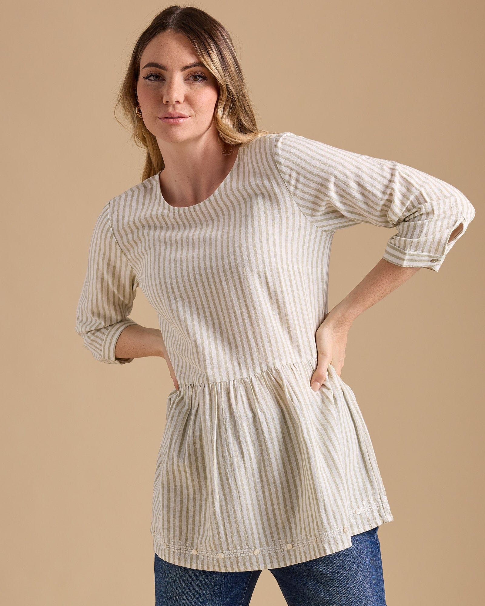 Woman in a vertical striped peplum blouse